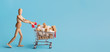 © Prostock-studio - Shopping cart with sugar cubes on blue background