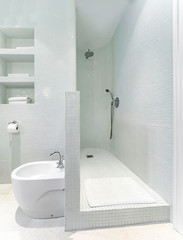 Wall Mural - Clean bright bathroom interior with modern shower and white tiles.