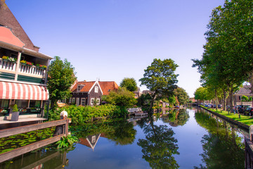 Canvas Print - Scene from picturesque cheese-making town of Edam, Holland with historic architecture and canal