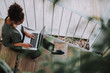 © Yakobchuk Olena - Afro american young woman working on laptop