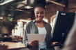 © Yakobchuk Olena - Charming afro american girl holding blank paper card