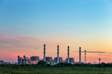 Wall Mural - Gas turbine electrical power plant with sunset