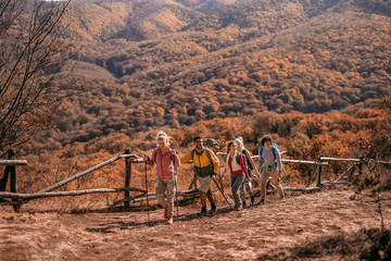 Poster - Hikers climbing the hill.