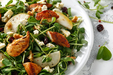 Pear, chicken salad with blue cheese, cranberry and walnuts. concept healthy food. white background