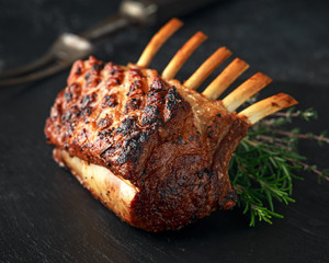 Wall Mural - Lamb rack roasted with herbs on stone board