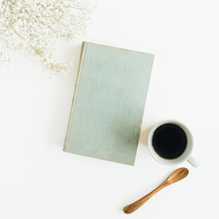 Wall Mural - Blogger desk with coffee, book, flowers on white background. Flat lay, top view.