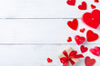 © juliasudnitskaya - Valentines day background with gift box and red hearts. Holiday greeting card.