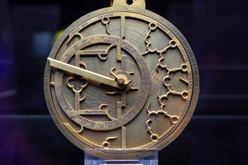 Astrolabe; based on a Spanish Instrument in Gothic style from the 14th century, which betrays strong intuences from the Arabic culture area. Old copper astrolabe detail close up.