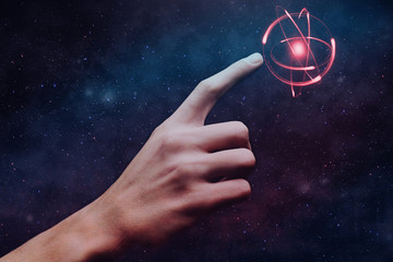 Aufkleber - Human forefinger touches atom. Nebula dust  in infinite space. Mixed media.