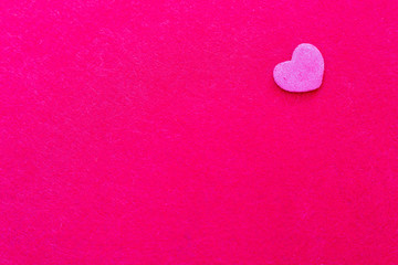 Pink heart shape on pink background