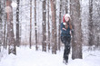 © alexkich - Girl in a winter park in snowfall
