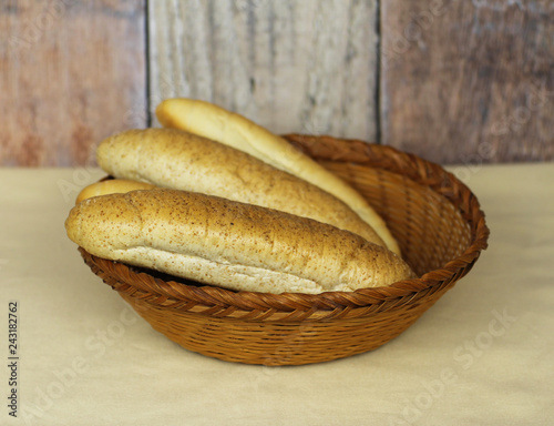 Fotografie, Obraz rolls in the old wicker scuttle on the table