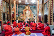 A Lot Of Monks Praying In Wat Luang Temple, In Pakse, Laos