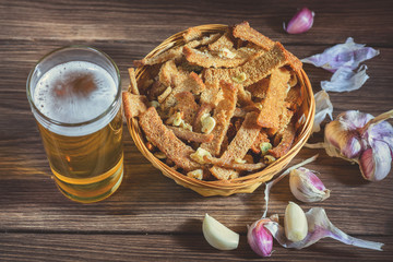 A bouquet of fresh beer and snacks with homemade, salted, rye rusks with garlic for beer. Very tasty homemade beer appetizer.