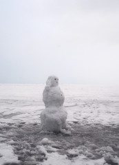 Wall Mural - Snowman on frozen sea at.