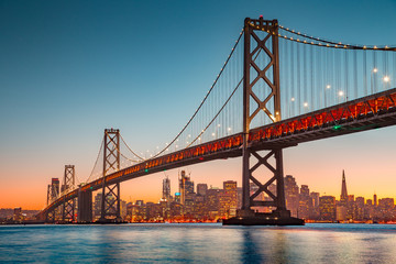 Wall Mural - San Francisco skyline with Oakland Bay Bridge at sunset, California, USA