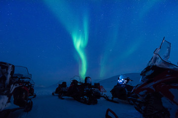 Wall Mural - the polar arctic northern lights aurora borealis sky star in norway svalbard in longyearbyen the sno