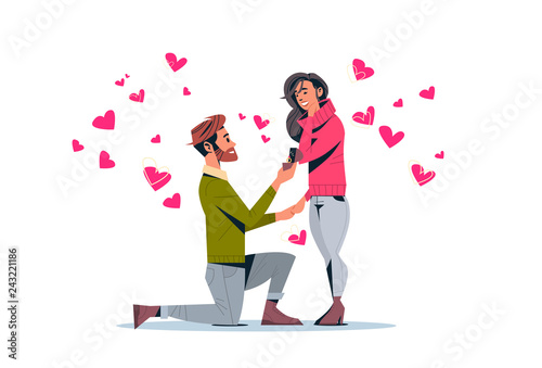 Fotomural man kneeling holding engagement ring proposing woman marry him happy valentines