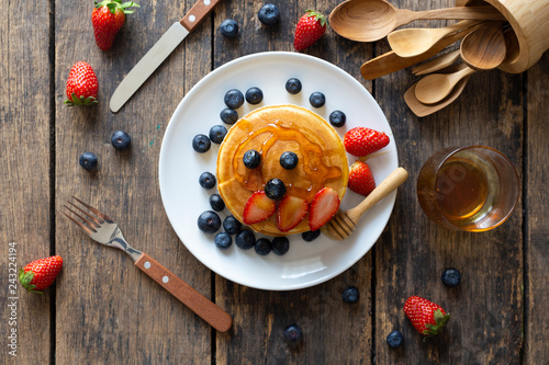 Fotografie, Obraz Delicious pancakes with Strawberry and blueberry on wooden table