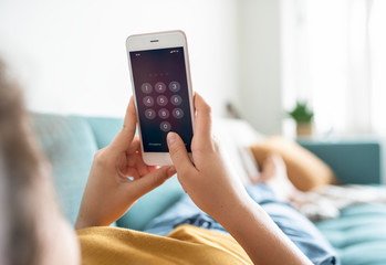 girl unlocking her smart phone