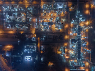 Wall Mural - Aerial top view Oil refinery factory at night for energy or gas industry.