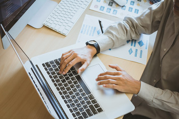 newsletter concept hand of businessman checking message box on digital laptop vintage tone filter.to