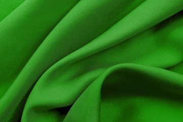 Green fabric texture for background and design, beautiful pattern of silk or linen.