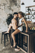 Beautiful loving couple kissing in the kitchen