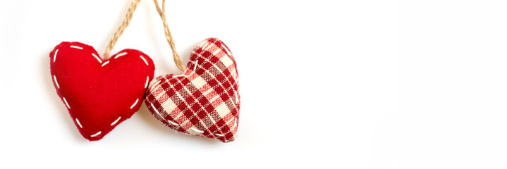 Wall Mural - two red fabric hearts on isolated on white panoramic background, love and valentine concept