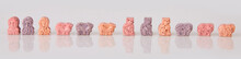 Various Vitamins For Kids On A White Background. Studio Lights. Assorted Animal Shaped Multivitamins For Kids. Chewable Pills