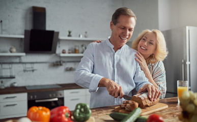 Wall Mural - Senior couple on kitchen