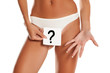 © vladimirfloyd - Woman with panties cowers her vagina with question mark drawn on sheet of paper on white background