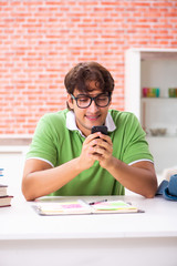 Young student preparing for exams at home 