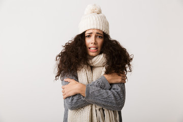 Poster - Upset young woman wearing winter scarf