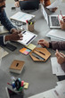 © LStockStudio - Multiethnic Group of Businesspeople on a Meeting