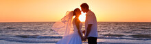 Bride And Groom Married Couple Kissing Sunset Beach Wedding