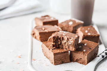 Raw vegan chocolate fudge on a white board.