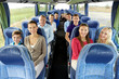 © Syda Productions - transport, tourism and travel concept - group of happy passengers travelling by bus