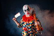 Bloody clown with meat cleaver and baseball bat