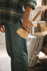 Wall Mural - Carpenter with mallet hammer at workshop