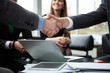 © opolja - Business people shaking hands, finishing up a meeting. Handshake. Business concept.