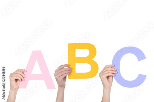 Fotografie, Obraz Hands holding the word ABC on white background