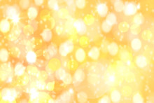 Festive Backgrounds. Abstract Festive Golden Yellow Bokeh Background Texture With Defocused Lights. Christmas Lights, Blurry Lights, Glitter Sparkle.