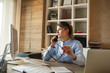 © BalanceFormCreative - Businesswoman in her office.She sitting at the desk and talking on the phone.
