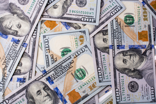 Fotografia American 100 dollar banknotes placed on white background