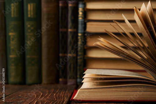 Fotografía Stack of books on bookshelf, close-up. Education learning concep
