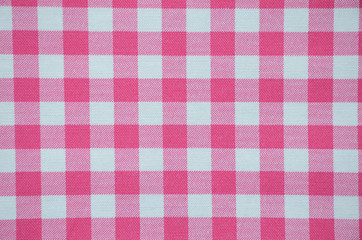 Pink plaid, checked texture, background. Pink and white checkered, vintage, old, retro abstract, textile. 