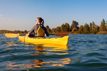 girl on a kayak on the river