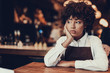 © Yakobchuk Olena - Tired young lady looking aside and sitting over table