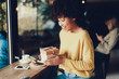 © Yakobchuk Olena - Cheerful lady holding present box in hands
